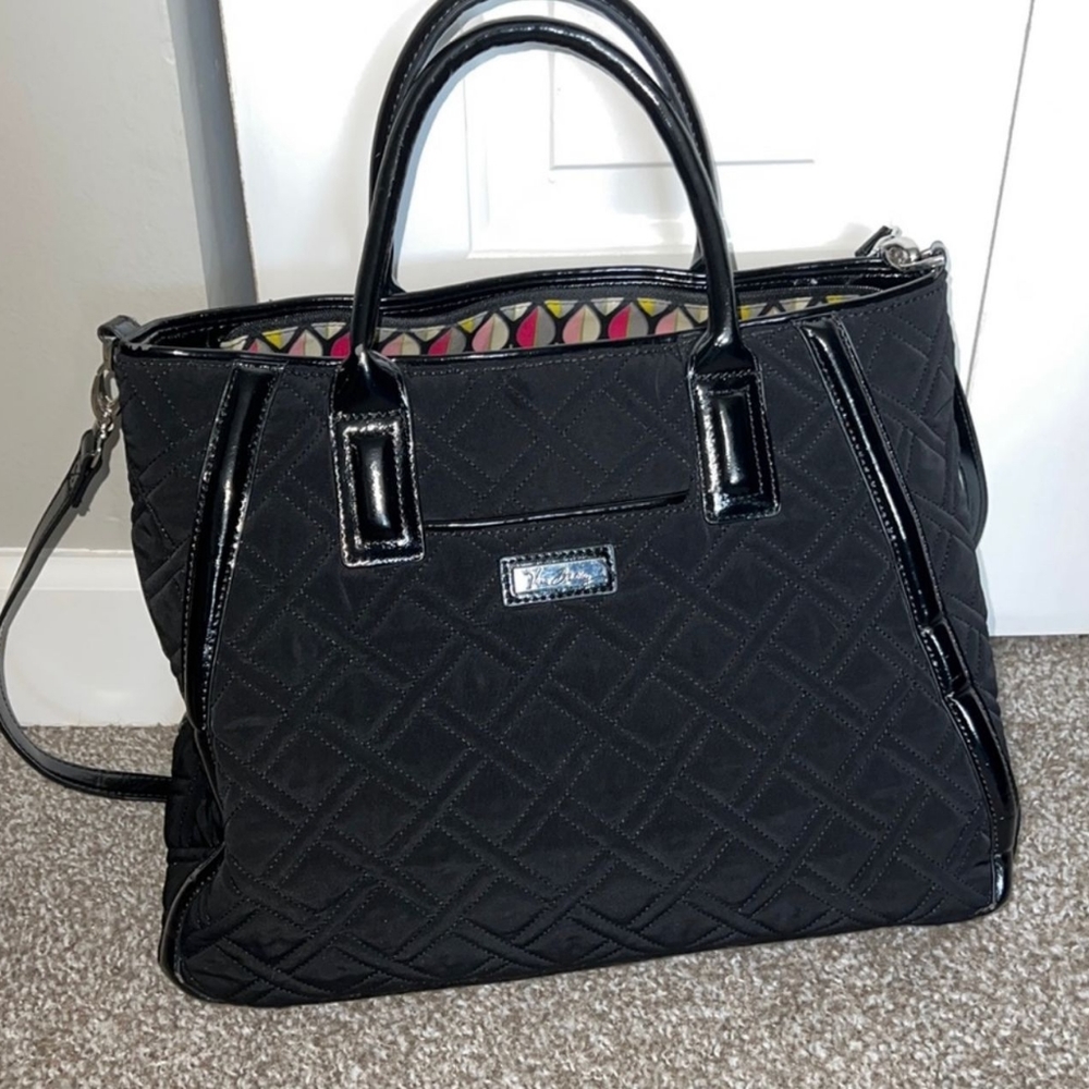 Vera Bradley black purse with shoulder strap& bottom feet